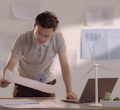 Engineer reviewing documents at a desk