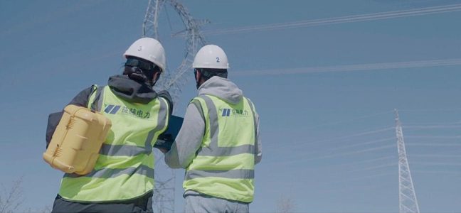 Engineers inspecting power lines